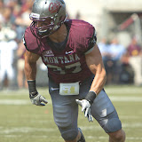 Jordan Tripp at the snap.  Washington - Grizzly Stadium, Montana Grizzlies vs. South Dakota Coyotes.  Missoula, MT, September 1st, 2012.