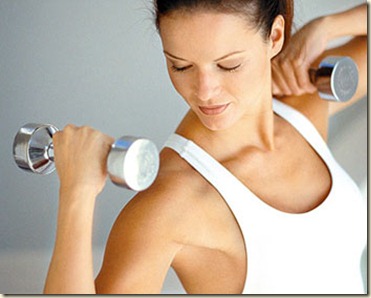 ca. 1999 --- Woman Exercising with Weights --- Image by © Michael Keller/CORBIS