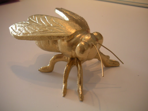 This great fly paperweight was rusted when I found it. So, I coated it with a gold, metallic spray paint.