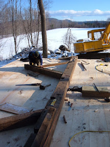 The homeowner wanted to clearspan the main room.  We added camber to the tie beam and scribed in a straining beam.