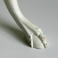 Detail of pedestal side table with ball and claw feet