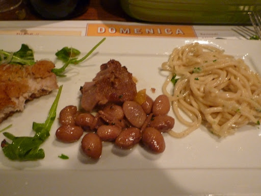 Roast pork with borlotti beans and housemade spaghetti with a light garlic sauce.