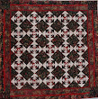 Christmas Pineapple pieced by Isabel and quilted by Don. I found the Christmas batik fabrics in Keepsake Quilting when i was there in April 2008. The technique was learned from Karin Hellaby's Sew Easy Pineapple book and the quilting design is Snazzy Snowflake