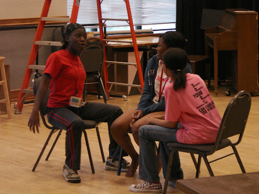 Two students vie to gain the full attention of a third student in this exercise. (photo credit: Sam Senovich)