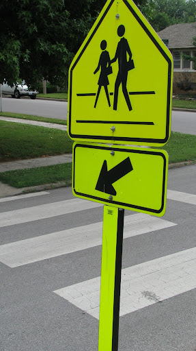 Crosswalk signs are a vital part of the Schools public safety plan reminding drivers to slow down around Schools. (Photo by: Kenrick Nobles)