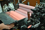 Here the ink is being rolled through -- I love all of the pinks in this shot!
