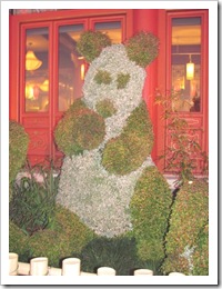 Florida vacation Epcot topiary panda bear in front of China Florida vacation Epcot topiary panda bear in front of China