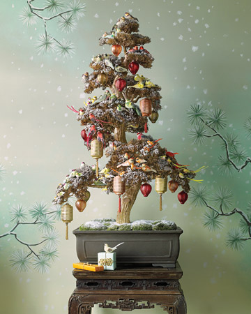 Japanese-lantern ornaments provide a pleasing change of scale on this artificial bonsai, but the crowning glories of this tree are the birds -- coated in glitter and grouped in flocks of like colors. Japanese-lantern ornaments provide a pleasing change of scale on this artificial bonsai, but the crowning glories of this tree are the birds -- coated in glitter and grouped in flocks of like colors.