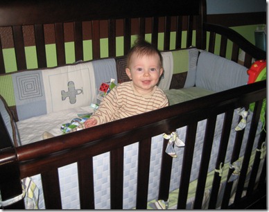 06 03 11 - First time sitting up in your crib (1)