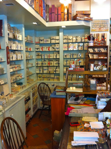 The back wall is full of stationary, all wrapped with fine ribbon.
