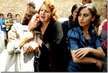 Palestinian Christian protesters lament forced conversions of loved ones. Palestinian Christian protesters lament forced conversions of loved ones.