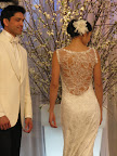 The beautiful detail on the back is shown on this Claire Pettibone dress. While the groom is wearing a white dinner jacket and black pants from Kleinfeld. The beautiful detail on the back is shown on this Claire Pettibone dress. While the groom is wearing a white dinner jacket and black pants from Kleinfeld.