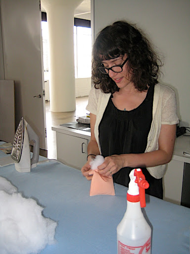 Corinne stuffing the ring pillow with batting.