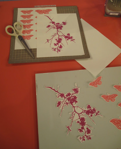 Those images are then cut out with scissors.