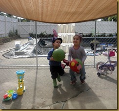 Sophia and Cohen planting herb garden