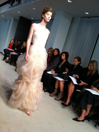 I also love this mermaid gown with a cut blossom skirt with tulle overlay.