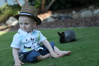 Posing on the grass with a rabbit