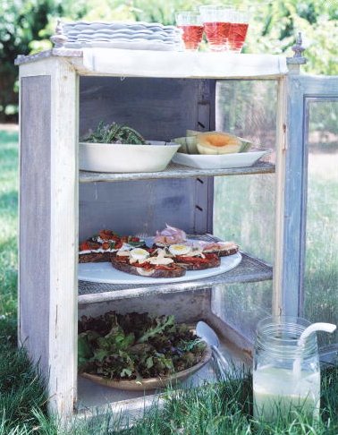 A vintage pie safe makes a great place to store food at a backyard picnic. (Martha Stewart Living, July 2001) A vintage pie safe makes a great place to store food at a backyard picnic. (Martha Stewart Living, July 2001)