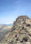 Easy scrambling on the granite blocks to the summit of the Pic Pedros (2842m)