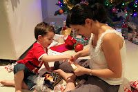 Oli helping Lou with her presents