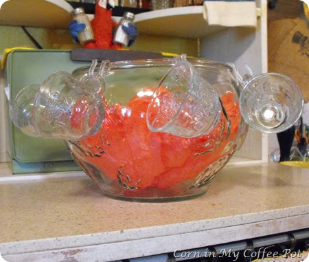 the punch bowl with red paper