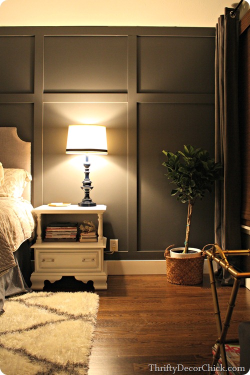 gray wall behind bed