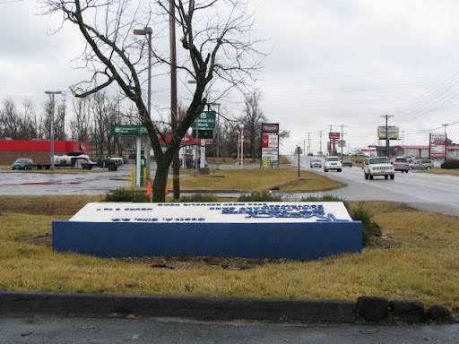 A large sign is damaged along Republic Road.