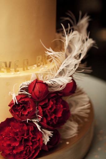 The flowers and feathers on our The People's Cake cake were handmade from sugar. The flowers and feathers on our The People's Cake cake were handmade from sugar.