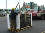 Getting ready to hoist up Solar Water Heating Panels on a Kingston Apartment building in the summer of 2007.
