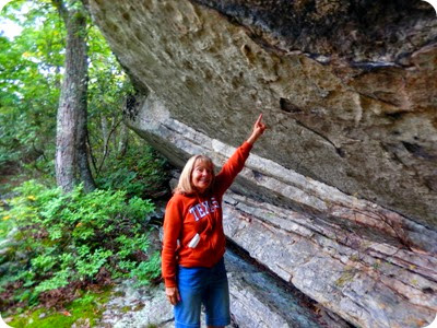 Marsha holding up boulder