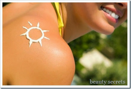 A sun made with suncream at the shoulder (shallow dof) A sun made with suncream at the shoulder (shallow dof)