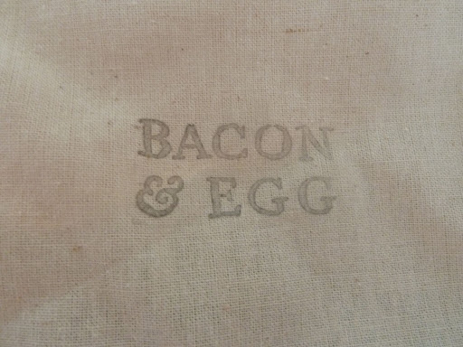 At the end of the night, as guests boarded the buses back to town, they were given breakfast sandwiches packed in muslin bags. Each was rubber stamped with the type of sandwich inside.