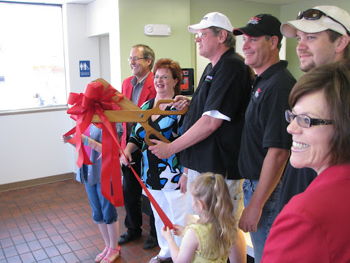 The ribbon cutting at the grand reopening of Bennett's Donuts. (Photo credit: Mike Smith)