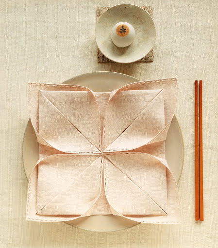 Instead of a bright red napkin for the Lotus fold, a subtle color is less bold and elegant.