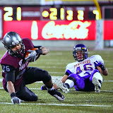Jordan Canada goes down after being tripped up by the UNI defense.