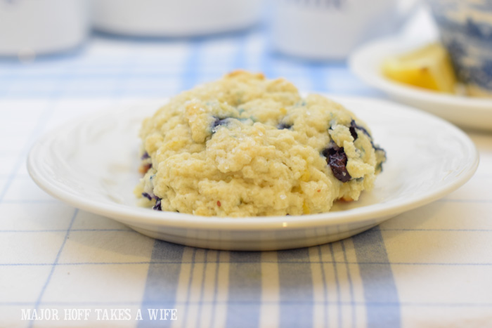 Knock off Starbucks blueberry scone copy cat recipe. A melt in your mouth recipe for blueberry scones. Inspired by Starbucks in house version, this blueberry scone with hints of lemon and a crunchy sugary top will delight everyone. Serve during High Tea, or just as a mid afternoon snack. Perfect along side tea or coffee, or as a stand alone blueberry dessert. You won't believe how easy these are to make! Never made scones before? Never fear, this includes a step by step tutorial on how to make scones. #HighTea #blueberries #Starbucks #scones #dessert Knock off Starbucks blueberry scone copy cat recipe