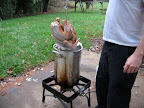 There turkey rack is connected to a turkey hook so your arm doesn't get too near the hot oil. It's a good idea to turn the flame off when slowly lowering the bird in case oil splatters.