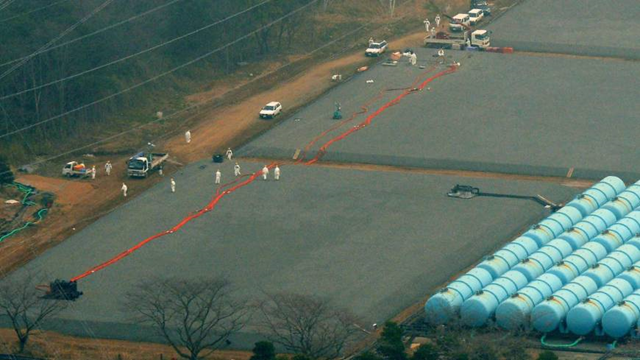 Where did it go?: Workers examine an underground tank on 6 April 2013 that leaked 120 tons of highly radioactive water at the Fukushima No. 1 nuclear plant in the town of Okuma. Photo: Kyodo