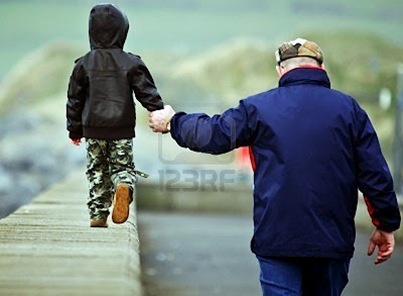 7852334-father-and-son-walking-hand-in-hand