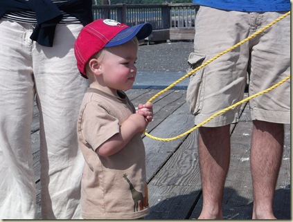 Helping daddy bring in the crab pot