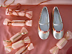 A cute shot of the favors and slippers, all decked out in sequins.