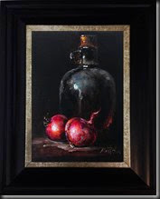 Bottle and red onions framed