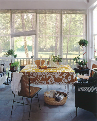 This beautiful screened porch mixes 1950s Allan Gould string chairs and a vintage glider with some contemporary wicker. This beautiful screened porch mixes 1950s Allan Gould string chairs and a vintage glider with some contemporary wicker.