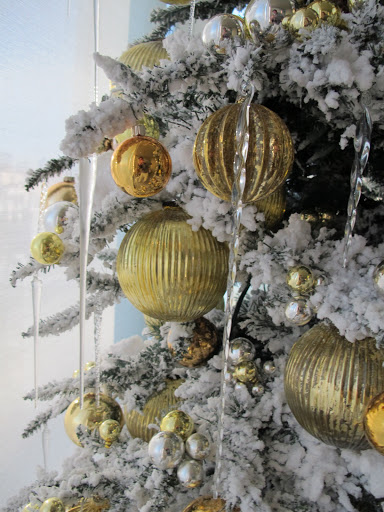 I only used yellow and gold ball ornaments, and the glass icicles that I buy every year, wherever I can find them.