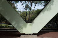 Date: December 2008
Location: Mexico City

Story: The usual walk while my charming wife is busy elsewhere. In this case giving some sort of speech. The form of the bridge seems to frame the trees behind it. Compelling in some way.