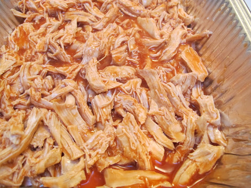 3. shred the (cooled) chicken and mix with hot sauce. pour the blue cheese-cream cheese mixture on top. mix to combine, bake and 20 minutes later you've got yourself some game-worthy grub.