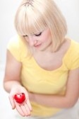 8999635-beautiful-lady-holding-heart