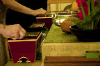 at altar, hands picking up incense.jpg