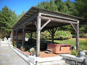 After a few years of exposing the pergola to the elements, the owners had a roof put on to protect the frame.