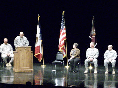 Sgt. Rob Radosevich, Lt. Col. Kevin J. Cruse (at podium), Mayor Sandra Johnson, Command Sgt. Major William P. Thayer, Chaplain Capt. Paul Weber